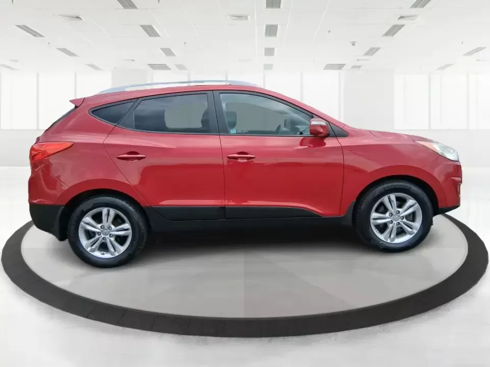 2013 Hyundai Tucson GLS (KM8JUCAC7DU) with an Theta II 2.4L I-4 DOHC engine, 6-Speed Automatic transmission, located at 1951 S Dayton Lakeview Rd., New Carlisle, OH, 45344, (937) 908-9800, 39.890999, -84.050255 - Need a dependable SUV that can handle Ohio weather, school drop-offs, and weekend getaways without stretching your budget? This 2013 Hyundai Tucson GLS in eye-catching Garnet Red is built for real life-comfortable for daily commuting, confident on slick winter roads, and practical for everything fro - Photo#1