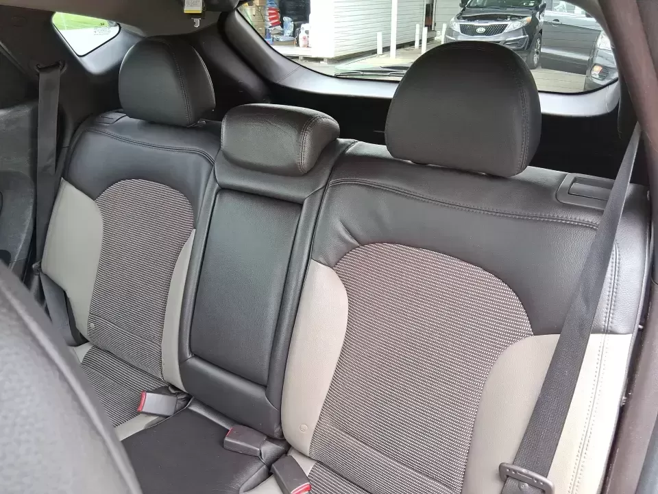 2013 Hyundai Tucson GLS (KM8JUCAC7DU) with an Theta II 2.4L I-4 DOHC engine, 6-Speed Automatic transmission, located at 1951 S Dayton Lakeview Rd., New Carlisle, OH, 45344, (937) 908-9800, 39.890999, -84.050255 - Need a dependable SUV that can handle Ohio weather, school drop-offs, and weekend getaways without stretching your budget? This 2013 Hyundai Tucson GLS in eye-catching Garnet Red is built for real life-comfortable for daily commuting, confident on slick winter roads, and practical for everything fro - Photo#10