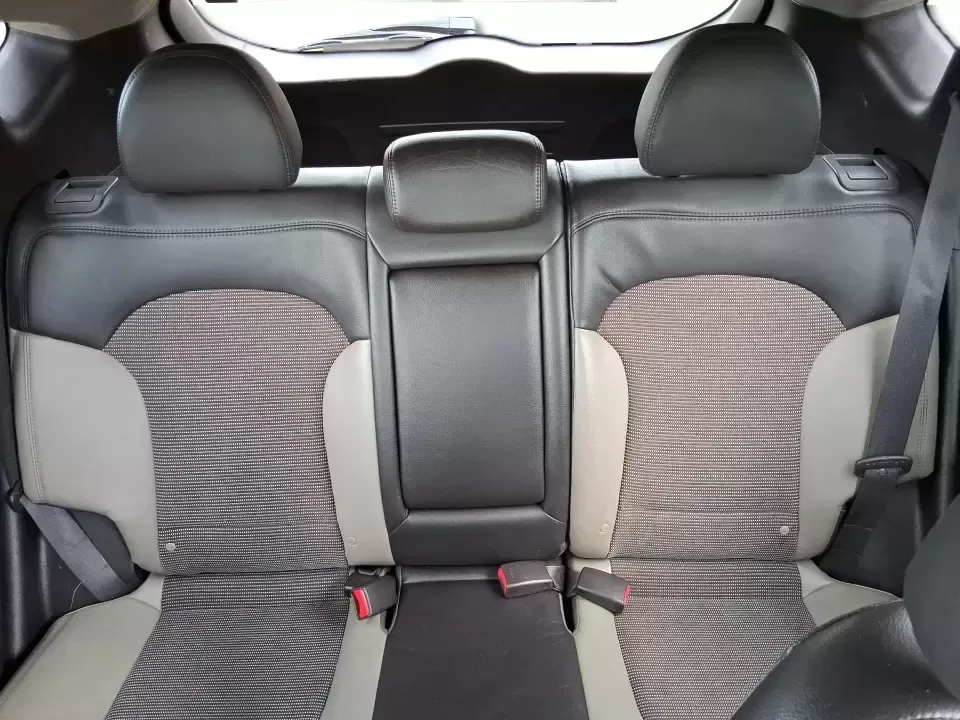 2013 Hyundai Tucson GLS (KM8JUCAC7DU) with an Theta II 2.4L I-4 DOHC engine, 6-Speed Automatic transmission, located at 1951 S Dayton Lakeview Rd., New Carlisle, OH, 45344, (937) 908-9800, 39.890999, -84.050255 - Need a dependable SUV that can handle Ohio weather, school drop-offs, and weekend getaways without stretching your budget? This 2013 Hyundai Tucson GLS in eye-catching Garnet Red is built for real life-comfortable for daily commuting, confident on slick winter roads, and practical for everything fro - Photo#14