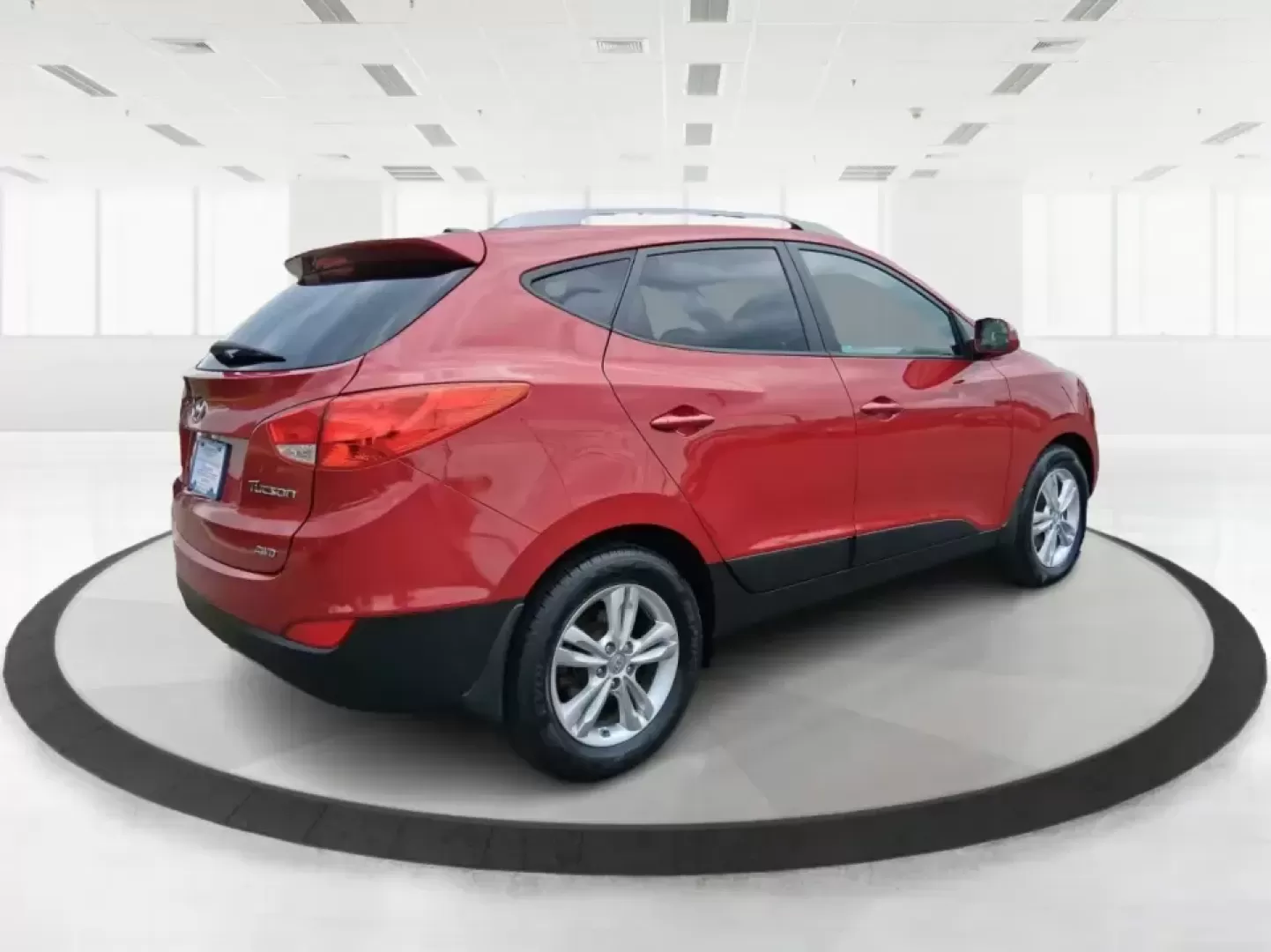 2013 Hyundai Tucson GLS (KM8JUCAC7DU) with an Theta II 2.4L I-4 DOHC engine, 6-Speed Automatic transmission, located at 8750 N County Rd 25A, Piqua, OH, 45356, (937) 908-9800, 40.164391, -84.232513 - Need a dependable SUV that can handle Ohio weather, school drop-offs, and weekend getaways without stretching your budget? This 2013 Hyundai Tucson GLS in eye-catching Garnet Red is built for real life-comfortable for daily commuting, confident on slick winter roads, and practical for everything fro - Photo#2