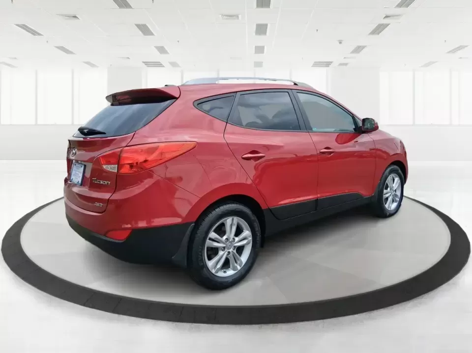 2013 Hyundai Tucson GLS (KM8JUCAC7DU) with an Theta II 2.4L I-4 DOHC engine, 6-Speed Automatic transmission, located at 8750 N County Rd 25A, Piqua, OH, 45356, (937) 908-9800, 40.164391, -84.232513 - Need a dependable SUV that can handle Ohio weather, school drop-offs, and weekend getaways without stretching your budget? This 2013 Hyundai Tucson GLS in eye-catching Garnet Red is built for real life-comfortable for daily commuting, confident on slick winter roads, and practical for everything fro - Photo#2