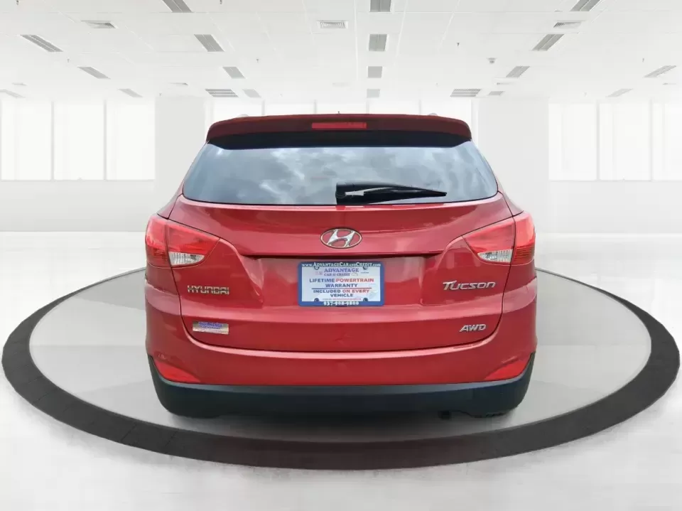 2013 Hyundai Tucson GLS (KM8JUCAC7DU) with an Theta II 2.4L I-4 DOHC engine, 6-Speed Automatic transmission, located at 8750 N County Rd 25A, Piqua, OH, 45356, (937) 908-9800, 40.164391, -84.232513 - Need a dependable SUV that can handle Ohio weather, school drop-offs, and weekend getaways without stretching your budget? This 2013 Hyundai Tucson GLS in eye-catching Garnet Red is built for real life-comfortable for daily commuting, confident on slick winter roads, and practical for everything fro - Photo#3