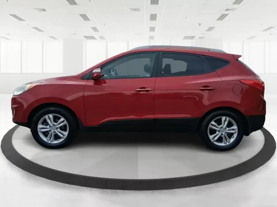 2013 Hyundai Tucson GLS (KM8JUCAC7DU) with an Theta II 2.4L I-4 DOHC engine, 6-Speed Automatic transmission, located at 8750 N County Rd 25A, Piqua, OH, 45356, (937) 908-9800, 40.164391, -84.232513 - Need a dependable SUV that can handle Ohio weather, school drop-offs, and weekend getaways without stretching your budget? This 2013 Hyundai Tucson GLS in eye-catching Garnet Red is built for real life-comfortable for daily commuting, confident on slick winter roads, and practical for everything fro - Photo#5