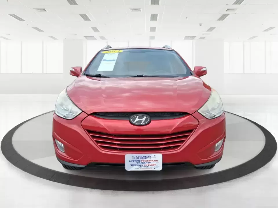 2013 Hyundai Tucson GLS (KM8JUCAC7DU) with an Theta II 2.4L I-4 DOHC engine, 6-Speed Automatic transmission, located at 8750 N County Rd 25A, Piqua, OH, 45356, (937) 908-9800, 40.164391, -84.232513 - Need a dependable SUV that can handle Ohio weather, school drop-offs, and weekend getaways without stretching your budget? This 2013 Hyundai Tucson GLS in eye-catching Garnet Red is built for real life-comfortable for daily commuting, confident on slick winter roads, and practical for everything fro - Photo#7