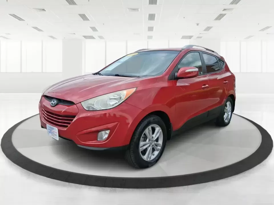 2013 Hyundai Tucson GLS (KM8JUCAC7DU) with an Theta II 2.4L I-4 DOHC engine, 6-Speed Automatic transmission, located at 8750 N County Rd 25A, Piqua, OH, 45356, (937) 908-9800, 40.164391, -84.232513 - Need a dependable SUV that can handle Ohio weather, school drop-offs, and weekend getaways without stretching your budget? This 2013 Hyundai Tucson GLS in eye-catching Garnet Red is built for real life-comfortable for daily commuting, confident on slick winter roads, and practical for everything fro - Photo#8