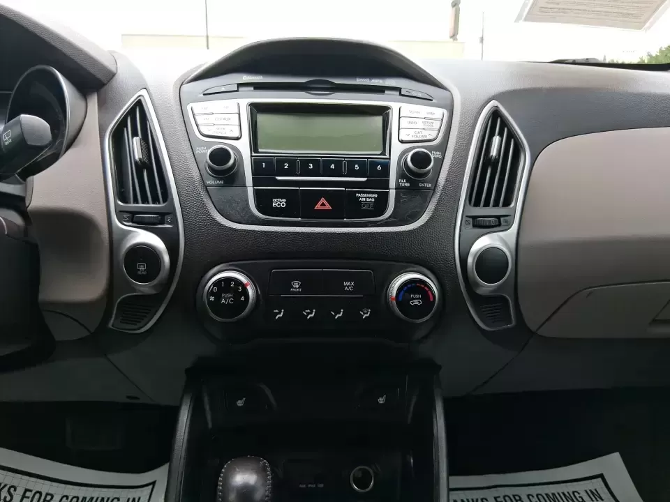 2013 Hyundai Tucson GLS (KM8JUCAC7DU) with an Theta II 2.4L I-4 DOHC engine, 6-Speed Automatic transmission, located at 8750 N County Rd 25A, Piqua, OH, 45356, (937) 908-9800, 40.164391, -84.232513 - Need a dependable SUV that can handle Ohio weather, school drop-offs, and weekend getaways without stretching your budget? This 2013 Hyundai Tucson GLS in eye-catching Garnet Red is built for real life-comfortable for daily commuting, confident on slick winter roads, and practical for everything fro - Photo#13