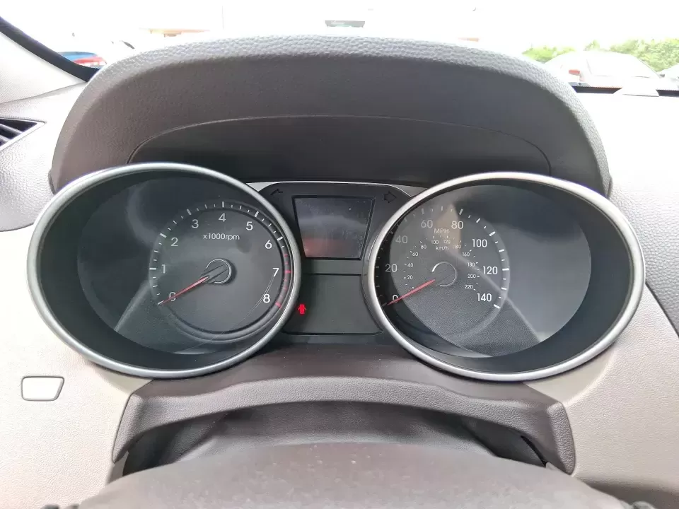 2013 Hyundai Tucson GLS (KM8JUCAC7DU) with an Theta II 2.4L I-4 DOHC engine, 6-Speed Automatic transmission, located at 8750 N County Rd 25A, Piqua, OH, 45356, (937) 908-9800, 40.164391, -84.232513 - Need a dependable SUV that can handle Ohio weather, school drop-offs, and weekend getaways without stretching your budget? This 2013 Hyundai Tucson GLS in eye-catching Garnet Red is built for real life-comfortable for daily commuting, confident on slick winter roads, and practical for everything fro - Photo#15