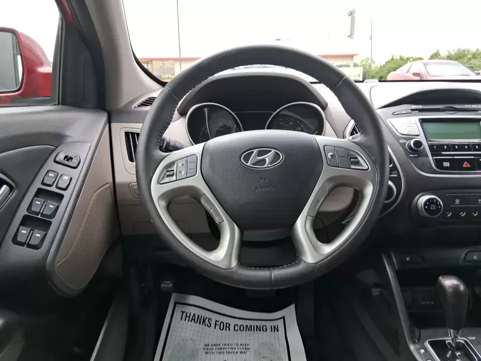 2013 Hyundai Tucson GLS (KM8JUCAC7DU) with an Theta II 2.4L I-4 DOHC engine, 6-Speed Automatic transmission, located at 8750 N County Rd 25A, Piqua, OH, 45356, (937) 908-9800, 40.164391, -84.232513 - Need a dependable SUV that can handle Ohio weather, school drop-offs, and weekend getaways without stretching your budget? This 2013 Hyundai Tucson GLS in eye-catching Garnet Red is built for real life-comfortable for daily commuting, confident on slick winter roads, and practical for everything fro - Photo#16