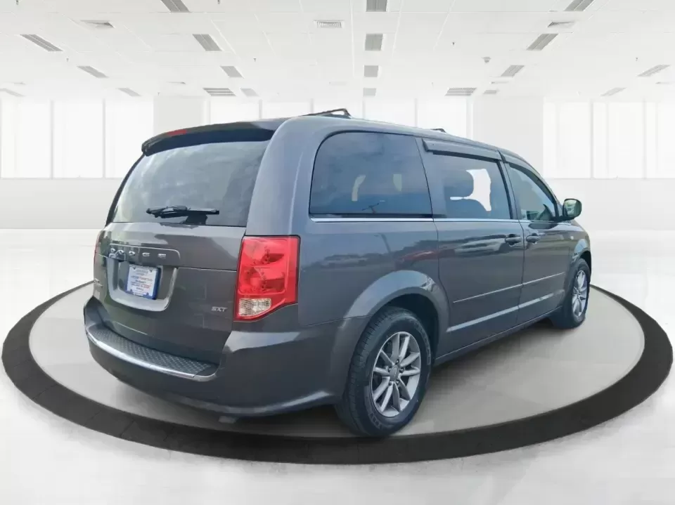 2014 Dodge Grand Caravan SXT 30th Anniversary (2C4RDGCGXER) with an 3.6L V-6 DOHC engine, 6-Speed Automatic transmission, located at 1951 S Dayton Lakeview Rd., New Carlisle, OH, 45344, (937) 908-9800, 39.890999, -84.050255 - Load up the kids, the coolers, and the weekend plans-this 2014 Dodge Grand Caravan SXT 30th Anniversary is built for real life in Ohio, whether you're handling school drop-offs, commuting down I70, or taking a road trip to the National Museum of the U.S. Air Force in nearby Dayton. With three rows a - Photo#2