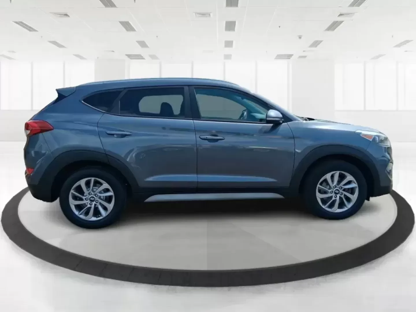 2018 Hyundai Tucson SEL Plus (KM8J33A4XJU) with an Nu 2L I-4 gasoline direct injection engine, 6A transmission, located at 880 E. National Road, Vandalia, OH, 45377, (937) 908-9800, 39.891918, -84.183594 - Need a do-it-all SUV that fits real life in Greene County-school runs, long commutes to Dayton, and weekend getaways to John Bryan State Park-without sacrificing comfort or confidence? This 2018 Hyundai Tucson SEL Plus in Coliseum Gray is built for drivers who want practical space, modern tech, and - Photo#1