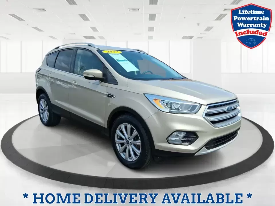 2017 Ford Escape Titanium (1FMCU9JD2HU) with an 1.5L L4 DOHC 16V engine, 6A transmission, located at 1230 East Main St, Xenia, OH, 45385, (937) 908-9800, 39.688026, -83.910172 - Whether you're a busy commuter running up and down US-35, a growing family juggling school drop-offs, or a weekend explorer heading out toward John Bryan State Park, this 2017 Ford Escape Titanium is the kind of compact SUV that fits real life in Xenia. With confident AWD capability, upscale comfort - Photo#0