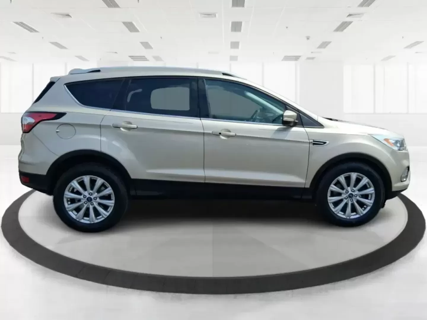 2017 Ford Escape Titanium (1FMCU9JD2HU) with an 1.5L L4 DOHC 16V engine, 6A transmission, located at 1230 East Main St, Xenia, OH, 45385, (937) 908-9800, 39.688026, -83.910172 - Whether you're a busy commuter running up and down US-35, a growing family juggling school drop-offs, or a weekend explorer heading out toward John Bryan State Park, this 2017 Ford Escape Titanium is the kind of compact SUV that fits real life in Xenia. With confident AWD capability, upscale comfort - Photo#1