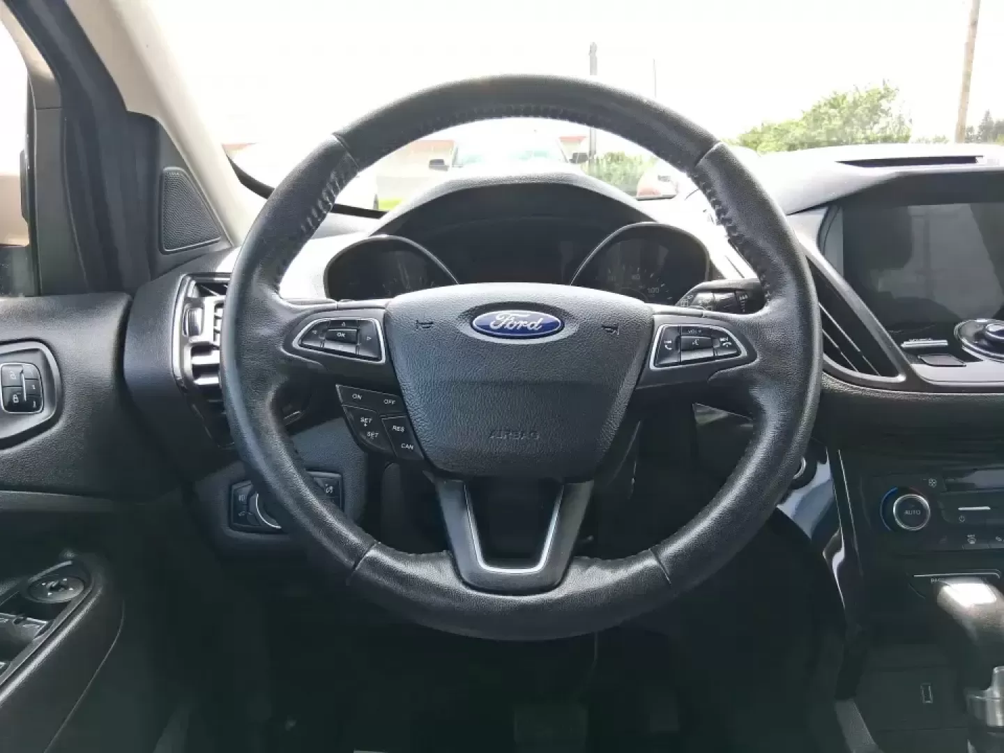 2017 Ford Escape Titanium (1FMCU9JD2HU) with an 1.5L L4 DOHC 16V engine, 6A transmission, located at 1230 East Main St, Xenia, OH, 45385, (937) 908-9800, 39.688026, -83.910172 - Whether you're a busy commuter running up and down US-35, a growing family juggling school drop-offs, or a weekend explorer heading out toward John Bryan State Park, this 2017 Ford Escape Titanium is the kind of compact SUV that fits real life in Xenia. With confident AWD capability, upscale comfort - Photo#16