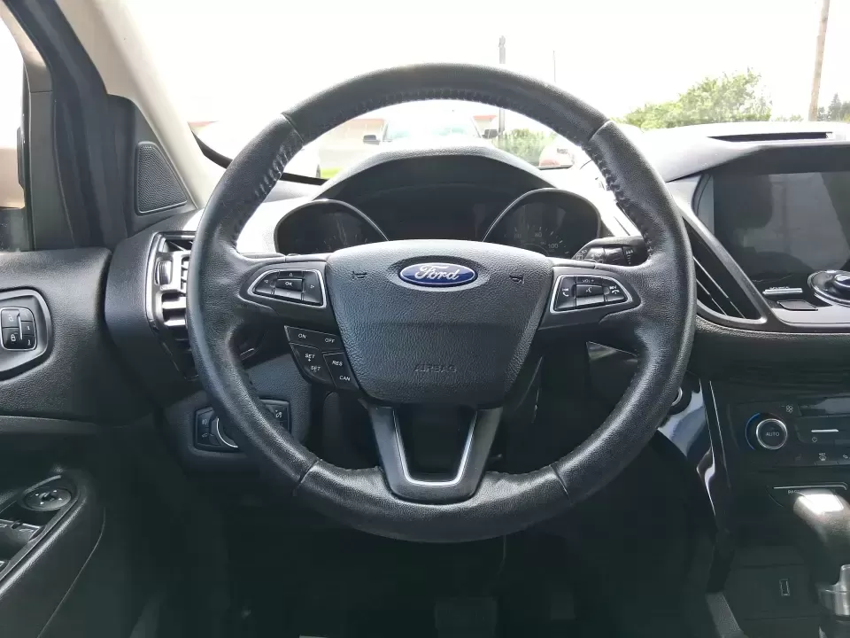 2017 Ford Escape Titanium (1FMCU9JD2HU) with an 1.5L L4 DOHC 16V engine, 6A transmission, located at 1230 East Main St, Xenia, OH, 45385, (937) 908-9800, 39.688026, -83.910172 - Whether you're a busy commuter running up and down US-35, a growing family juggling school drop-offs, or a weekend explorer heading out toward John Bryan State Park, this 2017 Ford Escape Titanium is the kind of compact SUV that fits real life in Xenia. With confident AWD capability, upscale comfort - Photo#16