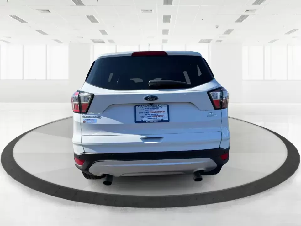 2017 Ford Escape SE (1FMCU0GD2HU) with an 1.5L L4 DOHC 16V engine, 6A transmission, located at 401 Woodman Dr, Riverside, OH, 45431, (937) 908-9800, 39.760899, -84.123421 - Picture a weekday that starts with a smooth commute up N County Rd 25A, turns into easy school drop-offs, and ends with a weekend escape to Indian Lake or a quick run down I75 for shopping and dinner-this 2017 Ford Escape SE is built for real life in and around Piqua, Ohio. Finished in standout Whit - Photo#3