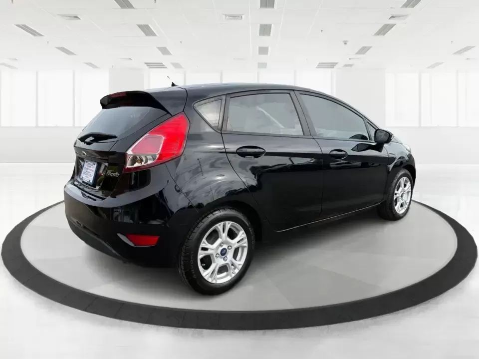 2016 Ford Fiesta SE (3FADP4EJ8GM) with an 1.6L L4 DOHC 16V engine, located at 8750 N County Rd 25A, Piqua, OH, 45356, (937) 908-9800, 40.164391, -84.232513 - Need a smart, easy-to-park hatchback that makes daily life simpler-whether you're commuting up I-75, running errands around downtown Piqua, or packing up for a weekend at Lock 9 Park? This 2016 Ford Fiesta SE Hatchback in Shadow Black delivers big practicality in a small, budget-friendly footprint, - Photo#2