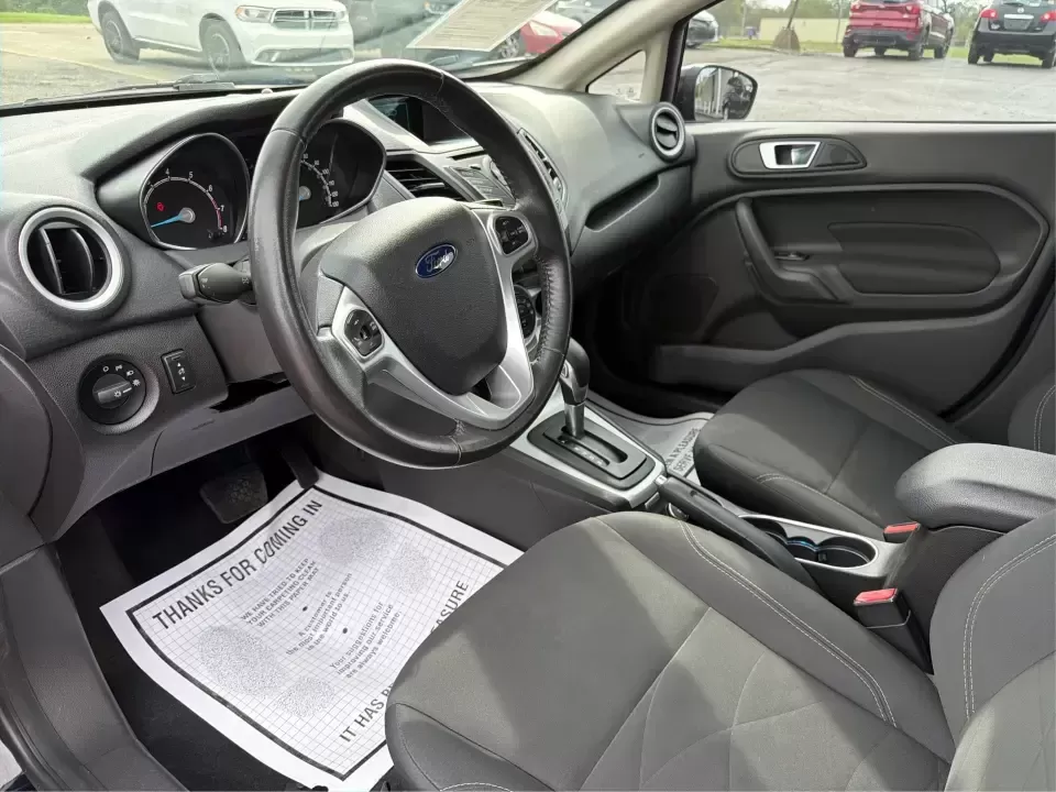 2016 Ford Fiesta SE (3FADP4EJ8GM) with an 1.6L L4 DOHC 16V engine, located at 8750 N County Rd 25A, Piqua, OH, 45356, (937) 908-9800, 40.164391, -84.232513 - Need a smart, easy-to-park hatchback that makes daily life simpler-whether you're commuting up I-75, running errands around downtown Piqua, or packing up for a weekend at Lock 9 Park? This 2016 Ford Fiesta SE Hatchback in Shadow Black delivers big practicality in a small, budget-friendly footprint, - Photo#9