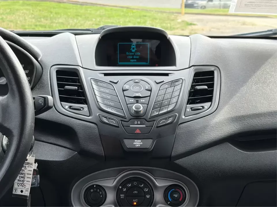 2016 Ford Fiesta SE (3FADP4EJ8GM) with an 1.6L L4 DOHC 16V engine, located at 8750 N County Rd 25A, Piqua, OH, 45356, (937) 908-9800, 40.164391, -84.232513 - Need a smart, easy-to-park hatchback that makes daily life simpler-whether you're commuting up I-75, running errands around downtown Piqua, or packing up for a weekend at Lock 9 Park? This 2016 Ford Fiesta SE Hatchback in Shadow Black delivers big practicality in a small, budget-friendly footprint, - Photo#13