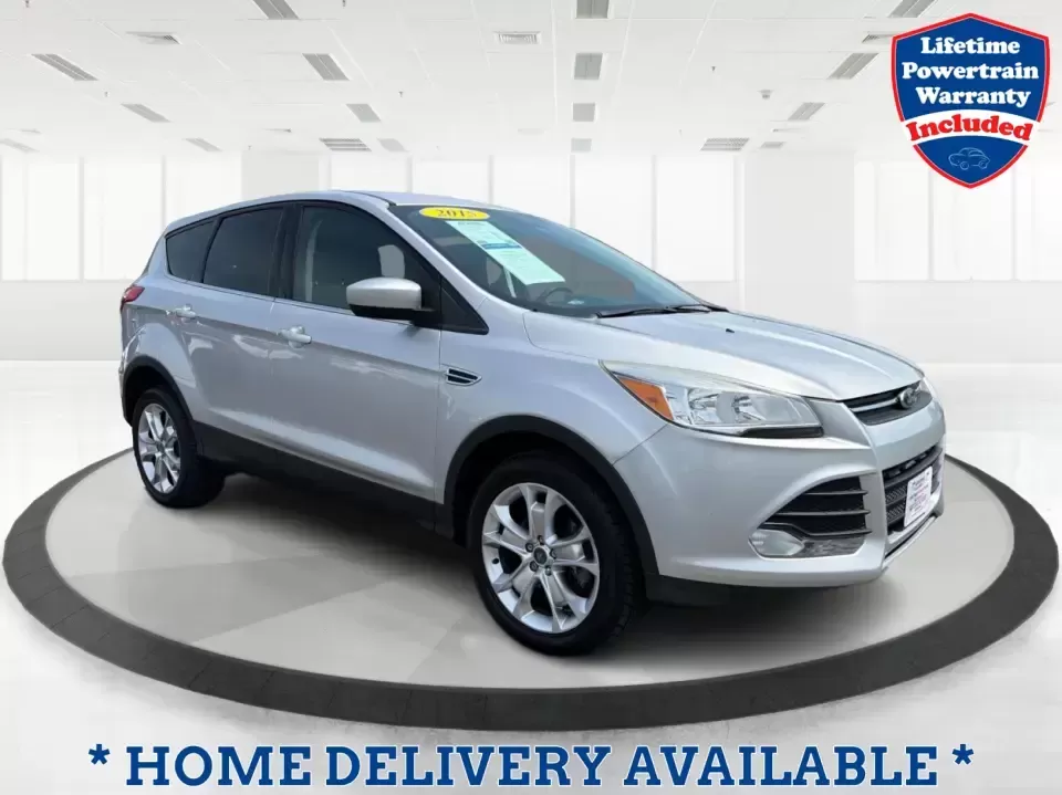 2015 Ford Escape SE (1FMCU9G98FU) with an 2.0L L4 DOHC 16V engine, 6-Speed Automatic transmission, located at 1099 N County Rd 25A , Troy, OH, 45373, (937) 908-9800, 40.057079, -84.212883 - Weekday commutes down I75, school drop-offs around Troy City Schools, and spontaneous weekend trips to Charleston Falls Preserve all get easier when you have an SUV that's the right size, the right power, and the right fit for your budget. This 2015 Ford Escape SE in Ingot Silver is built for real-l - Photo#0