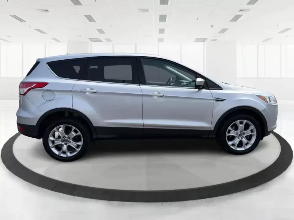 2015 Ford Escape SE (1FMCU9G98FU) with an 2.0L L4 DOHC 16V engine, 6-Speed Automatic transmission, located at 1099 N County Rd 25A , Troy, OH, 45373, (937) 908-9800, 40.057079, -84.212883 - Weekday commutes down I75, school drop-offs around Troy City Schools, and spontaneous weekend trips to Charleston Falls Preserve all get easier when you have an SUV that's the right size, the right power, and the right fit for your budget. This 2015 Ford Escape SE in Ingot Silver is built for real-l - Photo#1