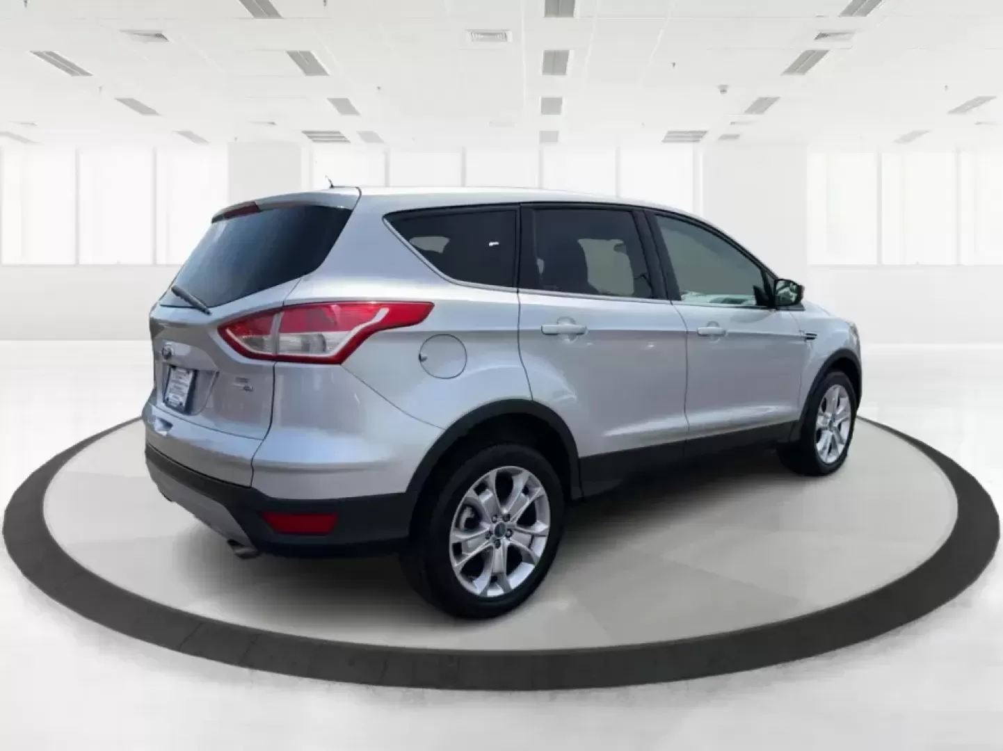2015 Ford Escape SE (1FMCU9G98FU) with an 2.0L L4 DOHC 16V engine, 6-Speed Automatic transmission, located at 1099 N County Rd 25A , Troy, OH, 45373, (937) 908-9800, 40.057079, -84.212883 - Weekday commutes down I75, school drop-offs around Troy City Schools, and spontaneous weekend trips to Charleston Falls Preserve all get easier when you have an SUV that's the right size, the right power, and the right fit for your budget. This 2015 Ford Escape SE in Ingot Silver is built for real-l - Photo#2