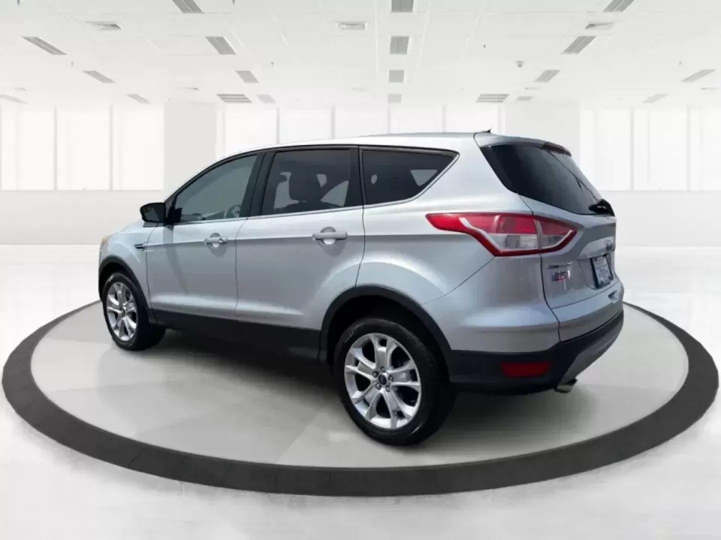 2015 Ford Escape SE (1FMCU9G98FU) with an 2.0L L4 DOHC 16V engine, 6-Speed Automatic transmission, located at 1099 N County Rd 25A , Troy, OH, 45373, (937) 908-9800, 40.057079, -84.212883 - Weekday commutes down I75, school drop-offs around Troy City Schools, and spontaneous weekend trips to Charleston Falls Preserve all get easier when you have an SUV that's the right size, the right power, and the right fit for your budget. This 2015 Ford Escape SE in Ingot Silver is built for real-l - Photo#4