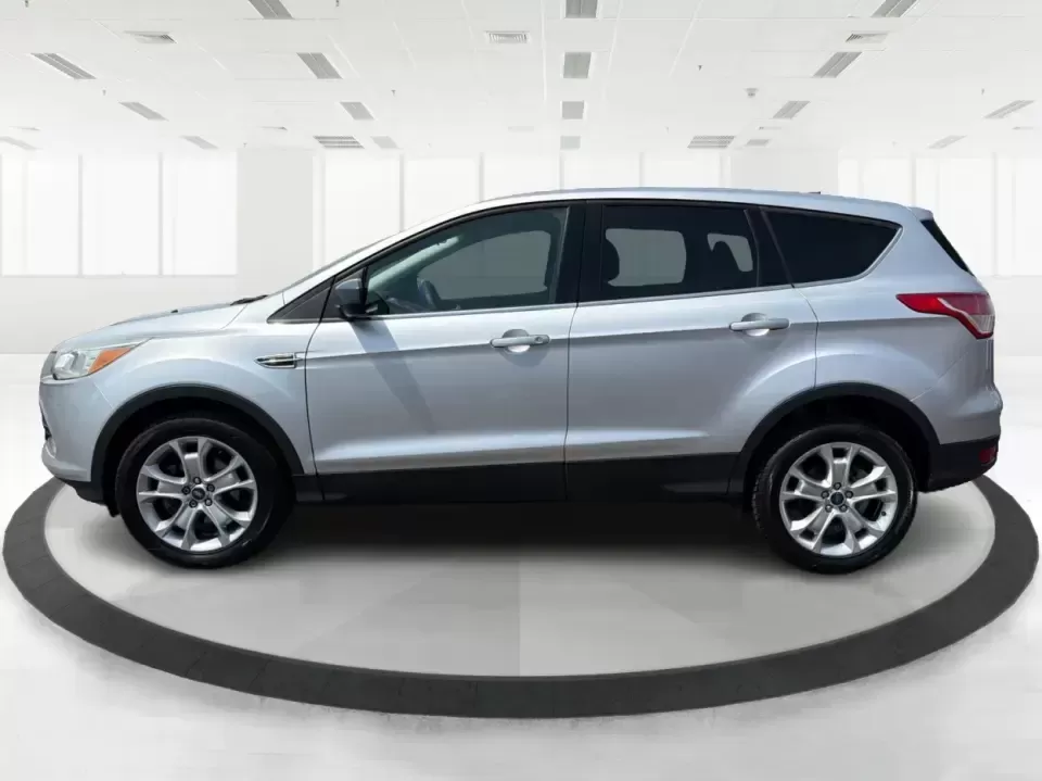 2015 Ford Escape SE (1FMCU9G98FU) with an 2.0L L4 DOHC 16V engine, 6-Speed Automatic transmission, located at 1099 N County Rd 25A , Troy, OH, 45373, (937) 908-9800, 40.057079, -84.212883 - Weekday commutes down I75, school drop-offs around Troy City Schools, and spontaneous weekend trips to Charleston Falls Preserve all get easier when you have an SUV that's the right size, the right power, and the right fit for your budget. This 2015 Ford Escape SE in Ingot Silver is built for real-l - Photo#5