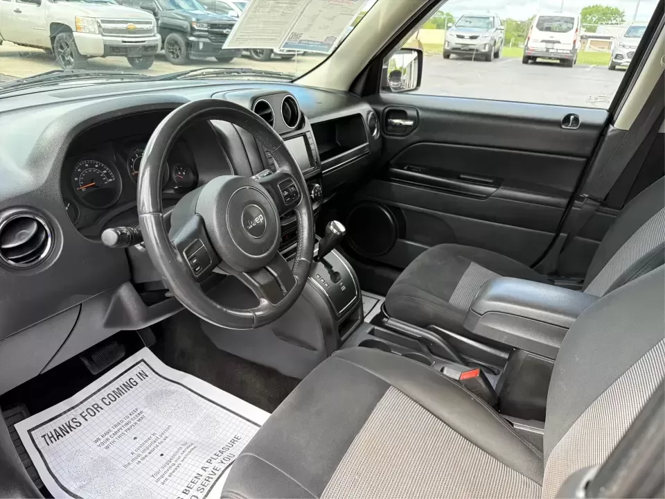 2014 Jeep Patriot Latitude (1C4NJRFB4ED) with an 2.4L I-4 DOHC engine, located at 8750 N County Rd 25A, Piqua, OH, 45356, (937) 908-9800, 40.164391, -84.232513 - Weekend adventures, winter commutes, and everyday errands feel a lot easier when you're in an SUV that's confident on Ohio backroads and comfortable in town. This **2014 Jeep Patriot Latitude 4WD** is a practical, go-anywhere choice for drivers who want Jeep capability without the full-size SUV foot - Photo#9