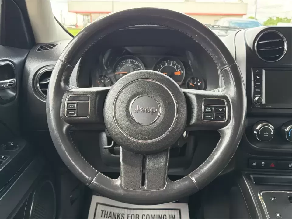 2014 Jeep Patriot Latitude (1C4NJRFB4ED) with an 2.4L I-4 DOHC engine, located at 8750 N County Rd 25A, Piqua, OH, 45356, (937) 908-9800, 40.164391, -84.232513 - Weekend adventures, winter commutes, and everyday errands feel a lot easier when you're in an SUV that's confident on Ohio backroads and comfortable in town. This **2014 Jeep Patriot Latitude 4WD** is a practical, go-anywhere choice for drivers who want Jeep capability without the full-size SUV foot - Photo#16