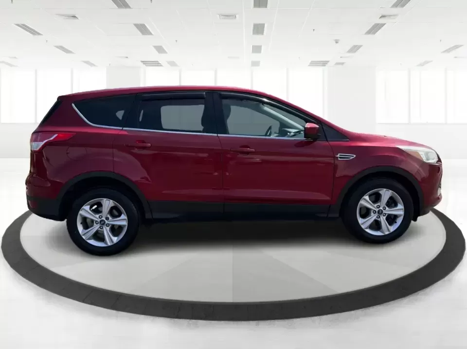 2014 Ford Escape SE (1FMCU9G9XEU) with an 2.0L L4 DOHC 16V engine, 6-Speed Automatic transmission, located at 4508 South Dixie Dr, Moraine, OH, 45439, (937) 908-9800, 39.689976, -84.218452 - Picture your next Ohio weekend: the kids loaded up for a day at Carillon Historical Park, a cooler in back for a picnic at Cox Arboretum, or a quick escape down I75 for a last-minute road trip-without worrying about whether your SUV can handle rain, slush, or a fully packed cargo area. This 2014 For - Photo#1