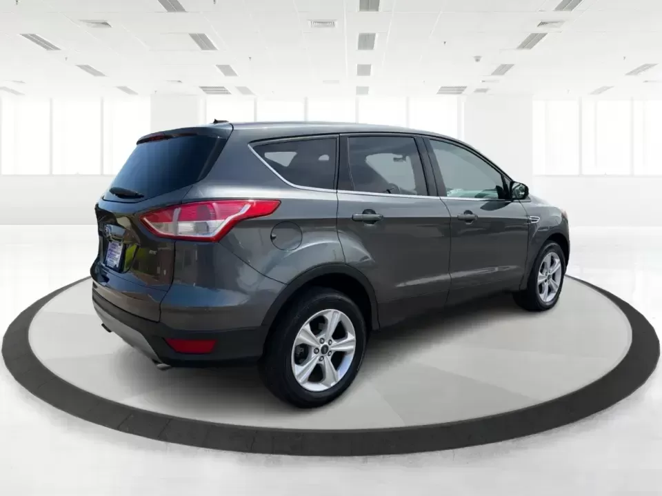 2016 Ford Escape SE (1FMCU0G77GU) with an 2.5L L4 DOHC 16V engine, 6-Speed Automatic transmission, located at 4508 South Dixie Dr, Moraine, OH, 45439, (937) 908-9800, 39.689976, -84.218452 - Whether you're commuting up and down South Dixie Drive, running errands between Moraine and Dayton, or packing up for a weekend getaway, this 2016 Ford Escape SE is the kind of practical SUV that fits real life. It's easy to park, comfortable for daily driving, and versatile enough for everything fr - Photo#2