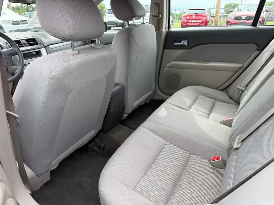 2012 Ford Fusion S (3FAHP0GA3CR) with an 2.5L I-4 DOHC engine, located at 1099 N County Rd 25A , Troy, OH, 45373, (937) 908-9800, 40.057079, -84.212883 - Need a dependable, budget-friendly sedan that can handle the weekday grind and still feel comfortable for weekend errands or a quick road trip to Dayton? This 2012 Ford Fusion S in sleek Tuxedo Black is a smart pick for commuters, first-time buyers, and growing families who want practical transporta - Photo#10