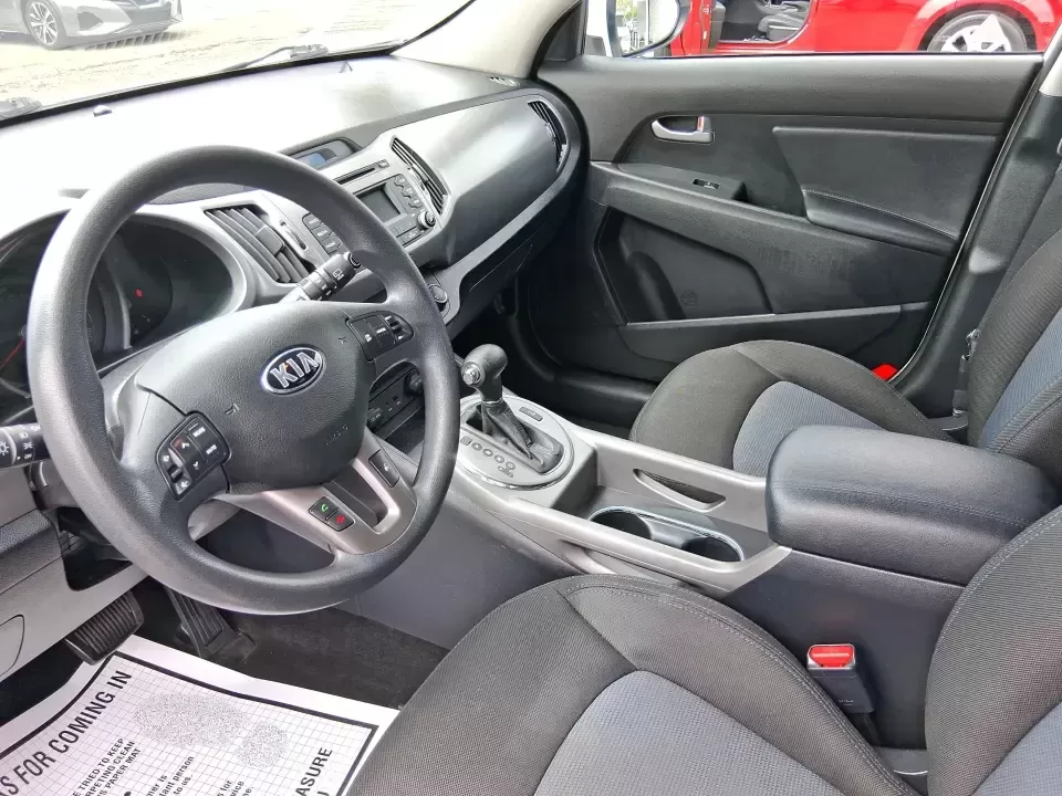 2015 Kia Sportage LX (KNDPBCAC2F7) with an 2.4L V6 DOHC 24V engine, 6-Speed Automatic transmission, located at 1184 Kauffman Ave, Fairborn, OH, 45324, (937) 908-9800, 39.807072, -84.030914 - Ready for weekend getaways at Caesar Creek, snowy commutes up I675, or everyday school-and-grocery runs around Fairborn and Beavercreek, this 2015 Kia Sportage LX is the kind of practical crossover that fits real life. With confident AWD/4WD capability, a comfortable cabin, and versatile cargo space - Photo#9