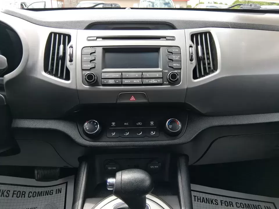 2015 Kia Sportage LX (KNDPBCAC2F7) with an 2.4L V6 DOHC 24V engine, 6-Speed Automatic transmission, located at 1184 Kauffman Ave, Fairborn, OH, 45324, (937) 908-9800, 39.807072, -84.030914 - Ready for weekend getaways at Caesar Creek, snowy commutes up I675, or everyday school-and-grocery runs around Fairborn and Beavercreek, this 2015 Kia Sportage LX is the kind of practical crossover that fits real life. With confident AWD/4WD capability, a comfortable cabin, and versatile cargo space - Photo#13