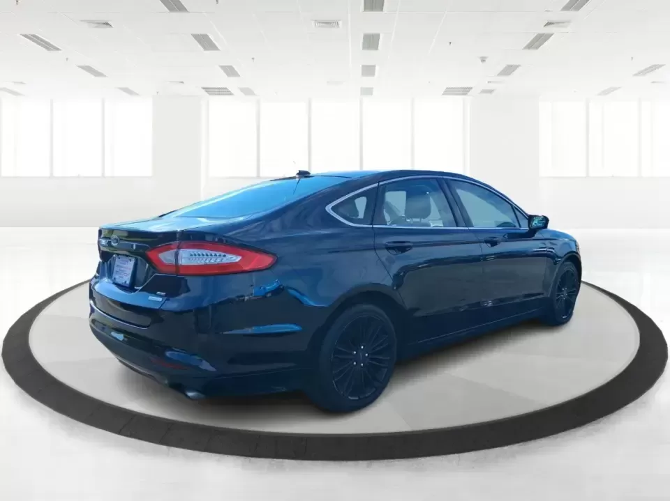 2014 Ford Fusion SE (3FA6P0HD8ER) with an 1.5L L4 DOHC 16V engine, located at 1099 N County Rd 25A , Troy, OH, 45373, (937) 908-9800, 40.057079, -84.212883 - Need a dependable commuter that still feels comfortable for date night in Beavercreek, errands around Xenia Station, and weekend drives out toward Caesars Creek? This 2014 Ford Fusion SE is the kind of smart, budget-friendly sedan that fits real life-easy to park downtown, smooth on longer stretches - Photo#2