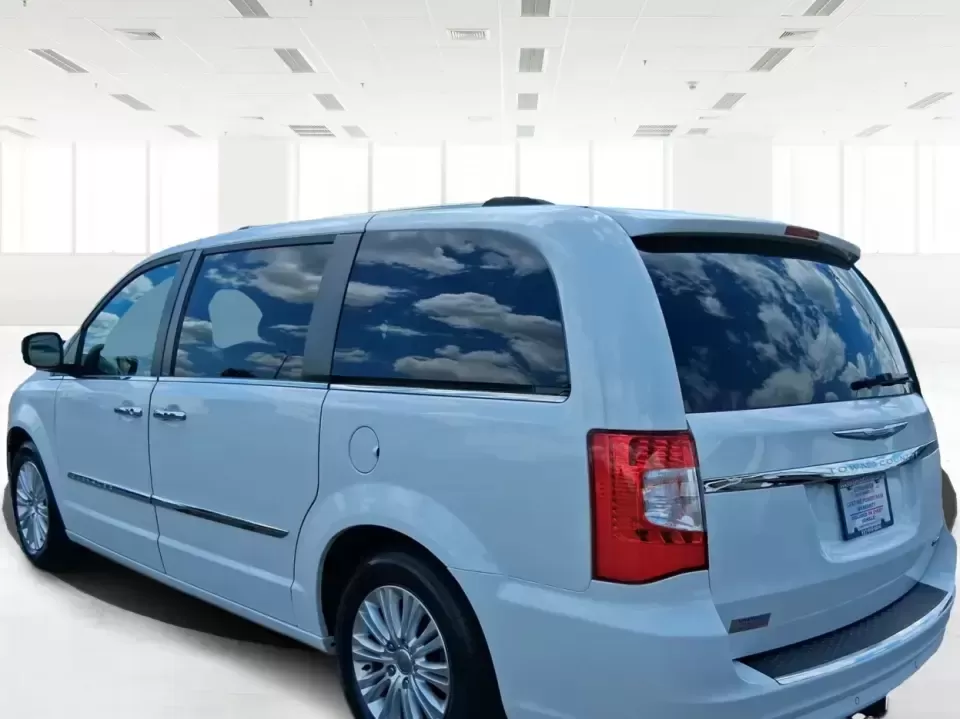 2014 Chrysler Town and Country Limited (2C4RC1GGXER) with an Pentastar 3.6L V-6 DOHC engine, 6-Speed Automatic transmission, located at 4508 South Dixie Dr, Moraine, OH, 45439, (937) 908-9800, 39.689976, -84.218452 - Road-trip ready and family-approved, this 2014 Chrysler Town and Country Limited is the kind of minivan that fits real life in Moraine-school drop-offs, grocery runs, weekend tournaments, and those longer drives up I-75 or across town toward Dayton. Finished in Bright White Clearcoat, it blends a - Photo#3