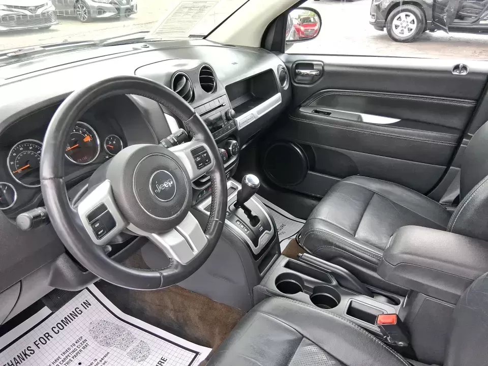 2017 Jeep Compass High Altitude FWD (1C4NJCEBXHD) with an 2.4L L4 DOHC 16V engine, CVT transmission, located at 1951 S Dayton Lakeview Rd., New Carlisle, OH, 45344, (937) 908-9800, 39.890999, -84.050255 - Picture your next week looking simpler: a comfortable SUV for the daily commute down I70, school drop-offs, and spontaneous Saturday drives to Buck Creek State Park-without feeling like you have to put your life on hold while you shop for financing. This 2017 Jeep Compass High Altitude FWD in Black - Photo#9