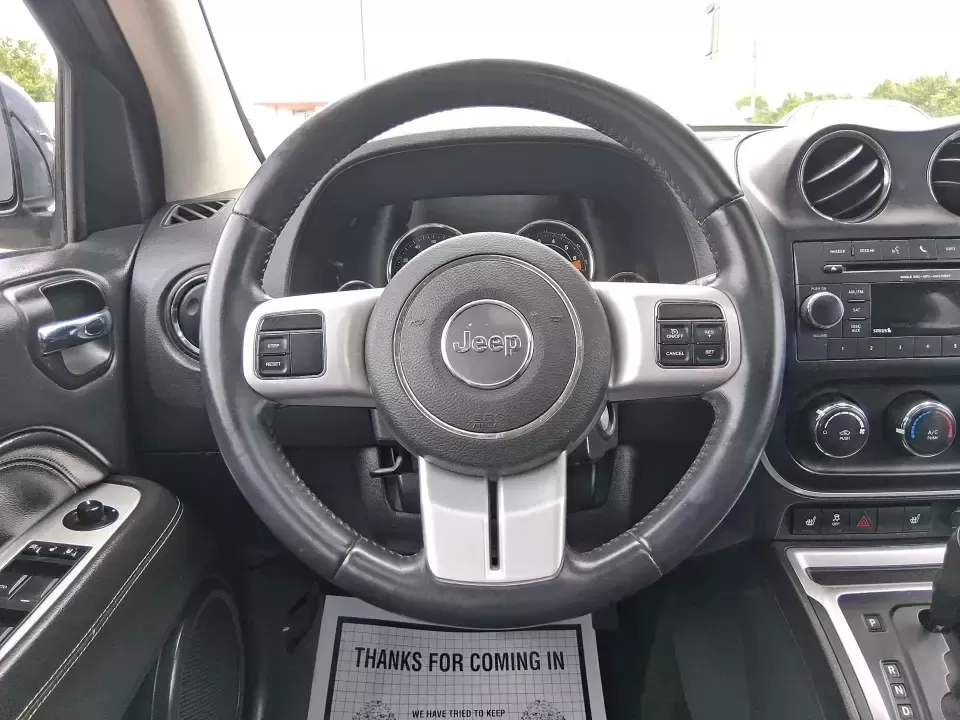 2017 Jeep Compass High Altitude FWD (1C4NJCEBXHD) with an 2.4L L4 DOHC 16V engine, CVT transmission, located at 1951 S Dayton Lakeview Rd., New Carlisle, OH, 45344, (937) 908-9800, 39.890999, -84.050255 - Picture your next week looking simpler: a comfortable SUV for the daily commute down I70, school drop-offs, and spontaneous Saturday drives to Buck Creek State Park-without feeling like you have to put your life on hold while you shop for financing. This 2017 Jeep Compass High Altitude FWD in Black - Photo#16