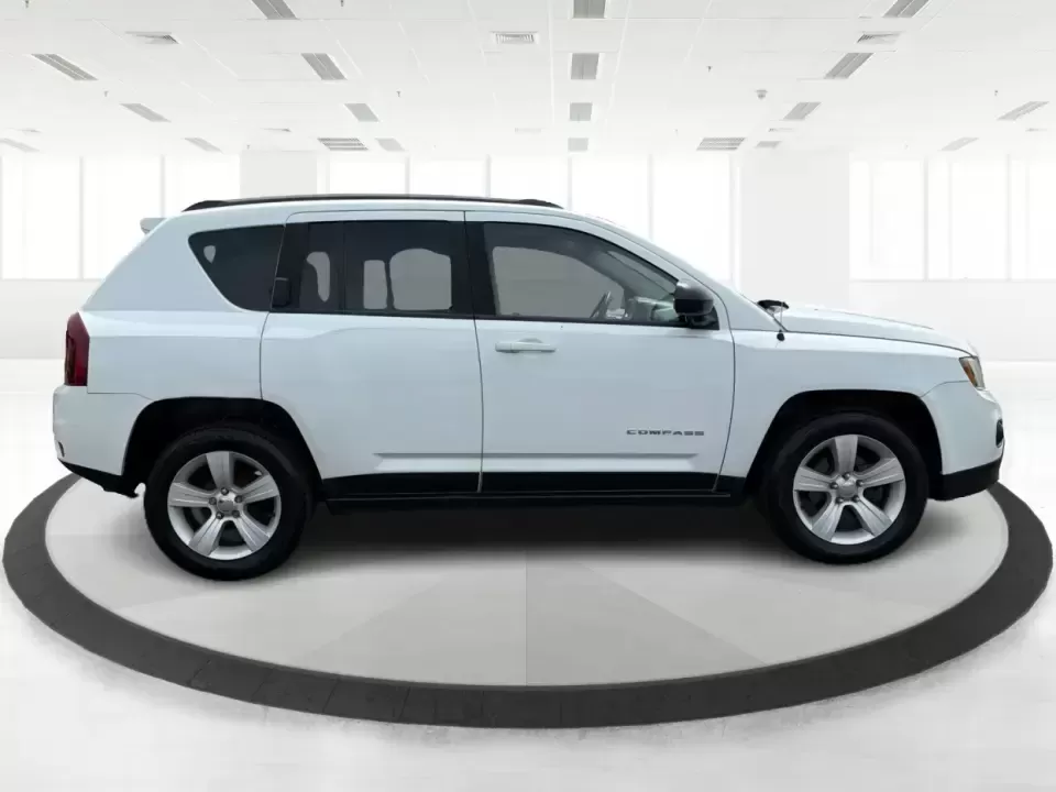 2016 Jeep Compass Sport (1C4NJCBA1GD) with an 2.0L L4 DOHC 16V engine, Automatic transmission, located at 4508 South Dixie Dr, Moraine, OH, 45439, (937) 908-9800, 39.689976, -84.218452 - **Adventure Awaits with the 2016 Jeep Compass Sport in Fairborn, OH!**<br /> <br /> Are you and your family ready to embark on thrilling weekend adventures or find the ideal companion for your daily commute? Look no further! The 2016 Jeep Compass Sport is the perfect SUV for those who need a dependa - Photo#1
