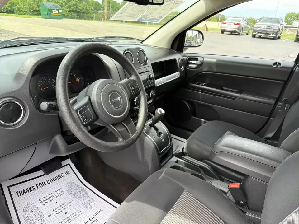 2016 Jeep Compass Sport (1C4NJCBA1GD) with an 2.0L L4 DOHC 16V engine, Automatic transmission, located at 4508 South Dixie Dr, Moraine, OH, 45439, (937) 908-9800, 39.689976, -84.218452 - **Adventure Awaits with the 2016 Jeep Compass Sport in Fairborn, OH!**<br /> <br /> Are you and your family ready to embark on thrilling weekend adventures or find the ideal companion for your daily commute? Look no further! The 2016 Jeep Compass Sport is the perfect SUV for those who need a dependa - Photo#9