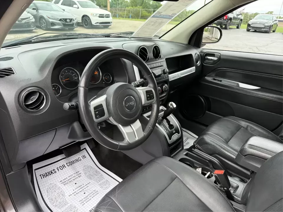 2016 Jeep Compass High Altitude Edition (1C4NJDEB2GD) with an 2.4L I-4 DOHC engine, 6A transmission, located at 8750 N County Rd 25A, Piqua, OH, 45356, (937) 908-9800, 40.164391, -84.232513 - Need a compact SUV that can handle Ohio weather, weekday commutes, and spontaneous weekend escapes without feeling bulky? This **2016 Jeep Compass High Altitude Edition 4WD** fits that lifestyle well-easy to park for errands around town, confident on wet back roads, and comfortable for longer drives - Photo#9