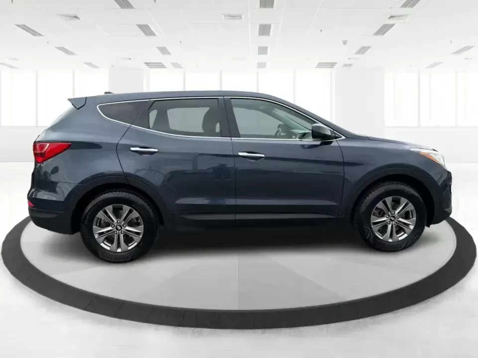 2015 Hyundai Santa Fe 2.4L (5XYZTDLB6FG) with an Theta II 2.4L I-4 gasoline direct injection engine, 6-Speed Automatic transmission, located at 401 Woodman Dr, Riverside, OH, 45431, (937) 908-9800, 39.760899, -84.123421 - Need one SUV that can handle school drop-offs, weekday commutes, and the occasional weekend escape to Eastwood MetroPark or a day trip down I-75? This 2015 Hyundai Santa Fe 2.4L in Mineral Gray fits that real-life rhythm with confident SUV versatility, family-friendly space, and comfort features tha - Photo#1