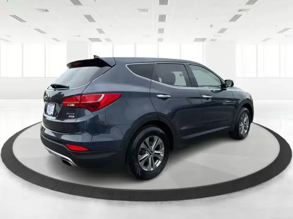 2015 Hyundai Santa Fe 2.4L (5XYZTDLB6FG) with an Theta II 2.4L I-4 gasoline direct injection engine, 6-Speed Automatic transmission, located at 401 Woodman Dr, Riverside, OH, 45431, (937) 908-9800, 39.760899, -84.123421 - Need one SUV that can handle school drop-offs, weekday commutes, and the occasional weekend escape to Eastwood MetroPark or a day trip down I-75? This 2015 Hyundai Santa Fe 2.4L in Mineral Gray fits that real-life rhythm with confident SUV versatility, family-friendly space, and comfort features tha - Photo#2