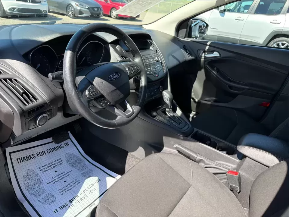 2018 Ford Focus SE (1FADP3F22JL) with an 2.0L L4 DOHC 16V engine, Automatic transmission, located at 4508 South Dixie Dr, Moraine, OH, 45439, (937) 908-9800, 39.689976, -84.218452 - Need a smart, efficient sedan for daily commutes down South Dixie Drive, quick runs to the Moraine Walmart area, or a reliable ride for work in Dayton and back? This 2018 Ford Focus SE is built for real life-easy to park, comfortable for longer drives, and fuel-friendly for the weekly grind. Finishe - Photo#9
