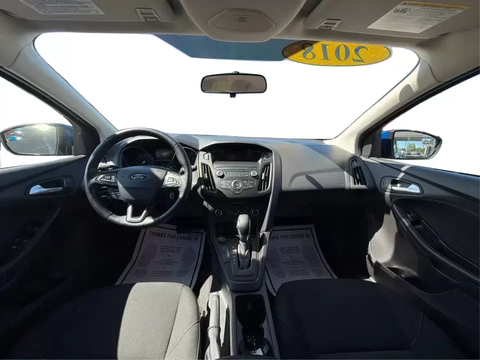 2018 Ford Focus SE (1FADP3F22JL) with an 2.0L L4 DOHC 16V engine, Automatic transmission, located at 4508 South Dixie Dr, Moraine, OH, 45439, (937) 908-9800, 39.689976, -84.218452 - Need a smart, efficient sedan for daily commutes down South Dixie Drive, quick runs to the Moraine Walmart area, or a reliable ride for work in Dayton and back? This 2018 Ford Focus SE is built for real life-easy to park, comfortable for longer drives, and fuel-friendly for the weekly grind. Finishe - Photo#21