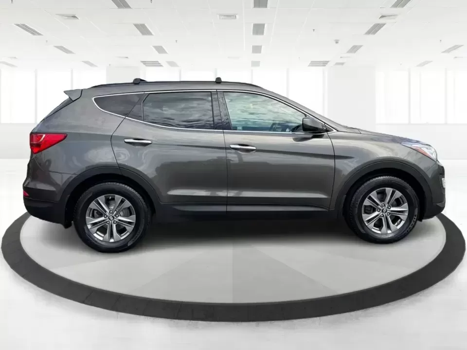 2014 Hyundai Santa Fe Sport 2.4 AWD (5XYZUDLB0EG) with an 2.4L L4 DOHC 16V engine, 6-Speed Automatic transmission, located at 4508 South Dixie Dr, Moraine, OH, 45439, (937) 908-9800, 39.689976, -84.218452 - Picture your next weekend escape: loading up the family, pointing the nose toward the MetroParks, and cruising I-75 with room for everyone and everything-without feeling like you're driving a bus. This 2014 Hyundai Santa Fe 2.4L in Cabo Bronze is a practical, road-trip-ready SUV that fits real life - Photo#1