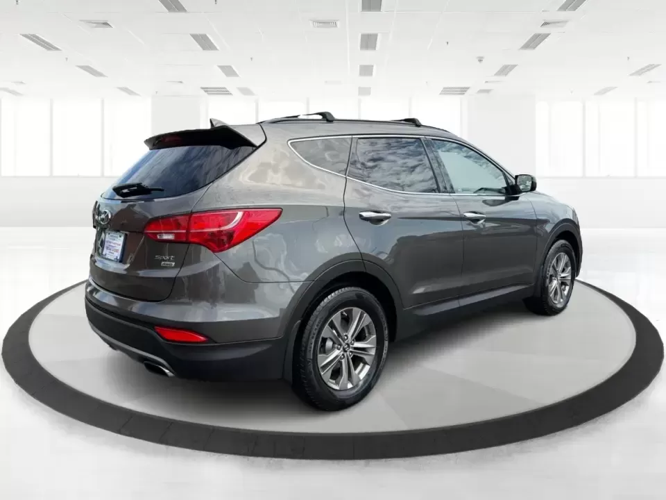 2014 Hyundai Santa Fe Sport 2.4 AWD (5XYZUDLB0EG) with an 2.4L L4 DOHC 16V engine, 6-Speed Automatic transmission, located at 4508 South Dixie Dr, Moraine, OH, 45439, (937) 908-9800, 39.689976, -84.218452 - Picture your next weekend escape: loading up the family, pointing the nose toward the MetroParks, and cruising I-75 with room for everyone and everything-without feeling like you're driving a bus. This 2014 Hyundai Santa Fe 2.4L in Cabo Bronze is a practical, road-trip-ready SUV that fits real life - Photo#2