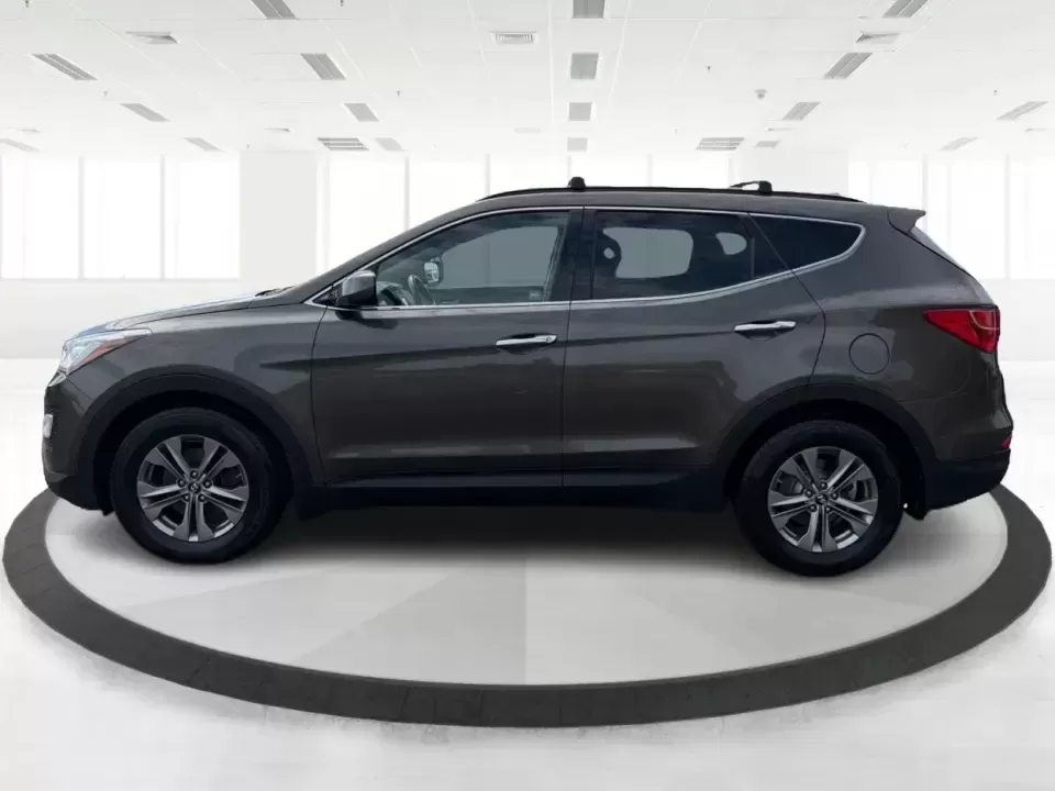 2014 Hyundai Santa Fe Sport 2.4 AWD (5XYZUDLB0EG) with an 2.4L L4 DOHC 16V engine, 6-Speed Automatic transmission, located at 4508 South Dixie Dr, Moraine, OH, 45439, (937) 908-9800, 39.689976, -84.218452 - Picture your next weekend escape: loading up the family, pointing the nose toward the MetroParks, and cruising I-75 with room for everyone and everything-without feeling like you're driving a bus. This 2014 Hyundai Santa Fe 2.4L in Cabo Bronze is a practical, road-trip-ready SUV that fits real life - Photo#5