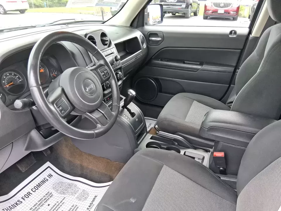 2016 Jeep Patriot Latitude 4WD (1C4NJRFB0GD) with an 2.4L L4 DOHC 16V engine, located at 1230 East Main St, Xenia, OH, 45385, (937) 908-9800, 39.688026, -83.910172 - Weekday commute down US-35, school drop-offs near Shawnee Park, and spontaneous weekend escapes to Caesar Creek State Park-this 2016 Jeep Patriot Latitude is built for the kind of Ohio lifestyle that mixes practical errands with let's get out of town freedom. Finished in Black Clearcoat and sized ju - Photo#9