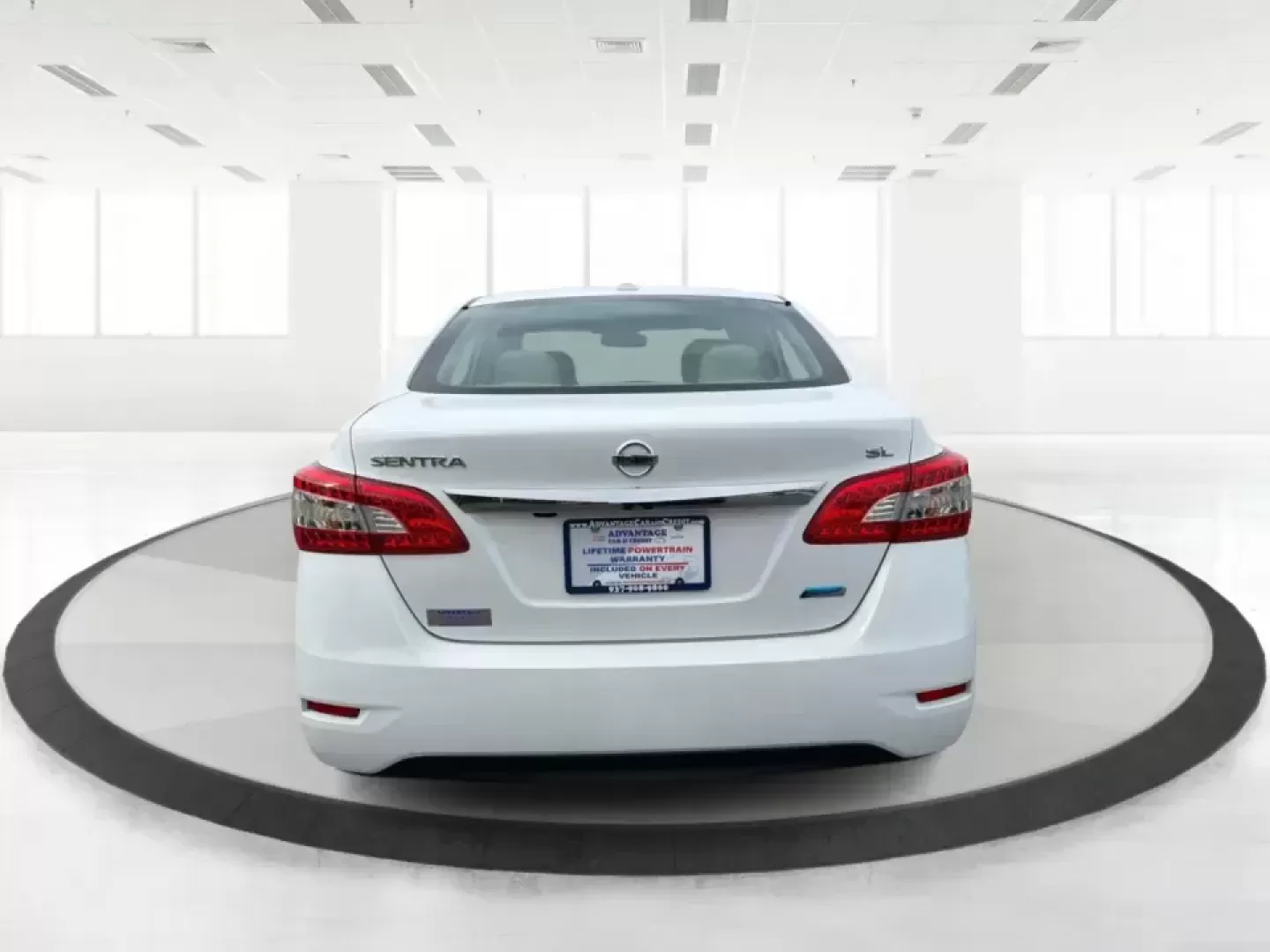 2014 Nissan Sentra SL (3N1AB7AP6EY) with an 1.8L I-4 DOHC engine, 6-Speed Manual transmission, located at 1099 N County Rd 25A , Troy, OH, 45373, (937) 908-9800, 40.057079, -84.212883 - Need a dependable commuter that's easy to park downtown, sips regular unleaded, and still feels comfortable for weekend getaways? This 2014 Nissan Sentra SL in Aspen White is a smart pick for Troy-area drivers who want a practical sedan with upscale touches and a driver-engaged feel thanks to its 6- - Photo#3